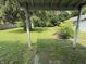 Spacious backyard with lush greenery, mature trees, and a covered porch at 11026 N Kitchen Rd, Mooresville, IN 46158