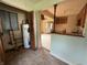 Basement featuring a water heater adjacent to a view of the kitchen and living spaces at 11026 N Kitchen Rd, Mooresville, IN 46158