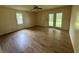 Bedroom with hardwood floors, ceiling fan and French doors leading to the backyard at 11026 N Kitchen Rd, Mooresville, IN 46158
