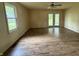 Bright bedroom with hardwood floors and French doors at 11026 N Kitchen Rd, Mooresville, IN 46158