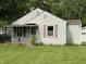 Charming single-story home with an iron-railed porch and light-colored siding at 11026 N Kitchen Rd, Mooresville, IN 46158