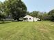 Quaint one-story home with a spacious lawn and detached garage at 11026 N Kitchen Rd, Mooresville, IN 46158