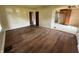 Expansive living room with hardwood flooring adjacent to kitchen at 11026 N Kitchen Rd, Mooresville, IN 46158