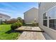 Backyard features a wooden deck with table and chairs, grass and fence at 11614 Gosling Dr, Indianapolis, IN 46229