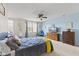 Bright and airy bedroom featuring a comfortable bed, natural light, and a calming blue accent wall at 11614 Gosling Dr, Indianapolis, IN 46229