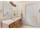 Bathroom featuring a large mirror and oak vanity at 1202 Orphant Annie, Greenfield, IN 46140