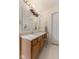 Bathroom featuring a large mirror and oak vanity at 1202 Orphant Annie, Greenfield, IN 46140