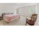 Bright bedroom featuring multiple windows, neutral carpet, and overhead lighting at 1202 Orphant Annie, Greenfield, IN 46140
