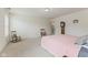 Spacious bedroom features carpeted flooring, rocking chairs, and neutral paint at 1202 Orphant Annie, Greenfield, IN 46140