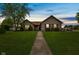 Charming single-story home with well-manicured lawn and inviting walkway at 1202 Orphant Annie, Greenfield, IN 46140