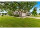 Charming single-story home featuring a well-manicured lawn, brick facade, and attached two-car garage at 1202 Orphant Annie, Greenfield, IN 46140