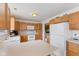 Open kitchen featuring white appliances and ample cabinet space at 1202 Orphant Annie, Greenfield, IN 46140