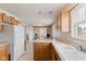 Bright kitchen with oak cabinets and view to dining area at 1202 Orphant Annie, Greenfield, IN 46140