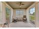 Cozy sunroom with natural light, comfortable seating, and serene views at 1202 Orphant Annie, Greenfield, IN 46140