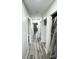 Clean hallway featuring modern vinyl flooring and freshly painted walls, leading to other rooms at 1206 Mcdougal St, Indianapolis, IN 46203