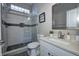 Bright bathroom featuring a glass-enclosed shower and modern vanity with a sleek countertop at 1209 Cottage Ave, Indianapolis, IN 46203