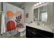Bathroom featuring a modern vanity, toilet, and shower with decorative curtain at 1209 Cottage Ave, Indianapolis, IN 46203
