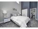 Spacious bedroom with neutral tones, high ceilings, and a view into another bedroom at 1209 Cottage Ave, Indianapolis, IN 46203