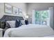 Bedroom featuring soft lighting and access to a private outdoor deck with seating at 1209 Cottage Ave, Indianapolis, IN 46203