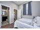 Bright bedroom with hardwood flooring and a view into an ensuite bathroom at 1209 Cottage Ave, Indianapolis, IN 46203
