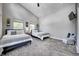 Bright bedroom with two beds, vaulted ceiling, neutral walls and modern decor at 1209 Cottage Ave, Indianapolis, IN 46203