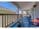 Charming covered porch featuring comfortable seating, a stylish rug, and wood railing at 1209 Cottage Ave, Indianapolis, IN 46203