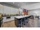 Modern kitchen with sleek countertops, stainless steel appliances, and a cozy island with bar stools at 1209 Cottage Ave, Indianapolis, IN 46203