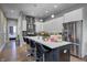 Bright, stylish kitchen featuring a large island, stainless steel appliances, and modern cabinetry at 1209 Cottage Ave, Indianapolis, IN 46203