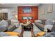 Inviting living room featuring dual sofas, a modern fireplace, and stylish interior design at 1209 Cottage Ave, Indianapolis, IN 46203