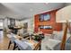 Open-concept living room showcases the kitchen, fireplace, and comfortable seating arrangements at 1209 Cottage Ave, Indianapolis, IN 46203