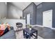 Modern living room with high ceilings features dark hardwood floors, stylish seating, and neutral walls at 1209 Cottage Ave, Indianapolis, IN 46203