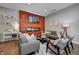 Cozy living room featuring a modern fireplace, stylish furniture, and warm lighting at 1209 Cottage Ave, Indianapolis, IN 46203