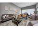 Comfortable living room featuring a sofa, chairs, area rug, and modern decor at 1209 Cottage Ave, Indianapolis, IN 46203
