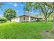 Charming home featuring a large backyard with mature trees at 12121 East 21St St, Indianapolis, IN 46229