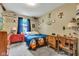 Charming bedroom featuring baseball-themed decor, a red dresser, and a cozy setup, great for sports enthusiasts at 12121 East 21St St, Indianapolis, IN 46229