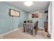 Inviting dining room with stylish decor, featuring a checkered tablecloth and ample light, perfect for Gathering gatherings at 12121 East 21St St, Indianapolis, IN 46229