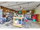 Spacious garage featuring ample storage space with shelving units and overhead lighting at 12121 East 21St St, Indianapolis, IN 46229