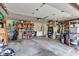 Spacious garage featuring ample storage space with shelving units and overhead lighting at 12121 East 21St St, Indianapolis, IN 46229