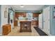 Bright kitchen featuring a butcher block island, white appliances, and oak cabinets at 12121 East 21St St, Indianapolis, IN 46229