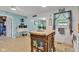 Bright kitchen featuring a butcher block island, oak cabinets, and an adjacent breakfast nook at 12121 East 21St St, Indianapolis, IN 46229