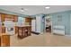Bright kitchen featuring a butcher block island, white appliances, and a tile floor at 12121 East 21St St, Indianapolis, IN 46229
