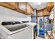 Functional laundry room with modern washer and dryer, cabinets, and storage solutions at 12121 East 21St St, Indianapolis, IN 46229