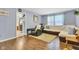 Inviting living room with light blue walls, hardwood flooring, and a comfortable leather recliner at 12121 East 21St St, Indianapolis, IN 46229