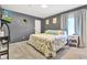 Calm main bedroom with gray walls, a patterned quilt, plush carpet, and a TV for added comfort at 12121 East 21St St, Indianapolis, IN 46229