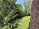 Beautifully maintained backyard with lush green lawn and mature trees at 1280 Shadow Ridge Rd, Indianapolis, IN 46280