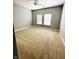Spacious carpeted bedroom with two windows and neutral gray walls at 1280 Shadow Ridge Rd, Indianapolis, IN 46280
