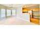 Bright living room with dining area adjacent to an open kitchen featuring wood cabinets at 1280 Shadow Ridge Rd, Indianapolis, IN 46280