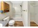 Compact bathroom featuring a bathtub and shower combination, and oak cabinets at 13094 N Etna Green Dr, Camby, IN 46113