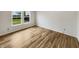 Well-lit bedroom featuring a large window with an outdoors view, ideal for a serene living space at 13094 N Etna Green Dr, Camby, IN 46113