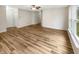 Spacious living room with hardwood floors, ceiling fan, and natural light at 13094 N Etna Green Dr, Camby, IN 46113